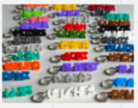 Colourful personalised name charms laid out in rows